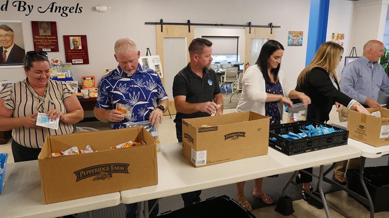 Katie and Kerry helped pack meals for The Children’s Hunger Project 